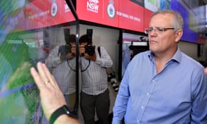 NSW fires: Australian prime minister Scott Morrison is briefed by NSW RFS Commissioner Shane Fitzsimmons on in the NSW Rural Fire Service control room on Sunday after returning from holiday in Hawaii.