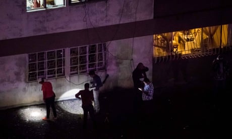 Venezuelan security forces stand guard and take evidence after an explosion targeted President Nicolas Maduro, in Caracas, Venezuela, 04 August 2018. The Venezuelan Information Minister, Jorge Rodriguez, confirmed that President Nicolas Maduro was the victim of an attack with 'drone-type flying devices that contained an explosive charge', and that he escaped unharmed from the incident, which occurred during a military ceremony in Caracas. EPA/MIGUEL GUTIERREZ