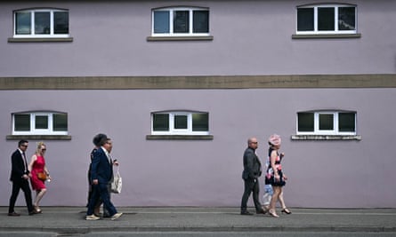 Racegoers walk on their way to attend Royal Ascot on Friday.