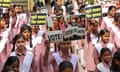 College students hold placards to create awareness for citizens to vote, in Varanasi, ahead of India's upcoming general elections.