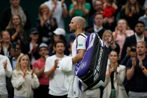 The Centre Court crowd applaud Adrian Mannarino as he leaves the pitch after retiring injured.