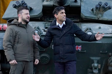 Prime Minister Rishi Sunak and Ukrainian President Volodymyr Zelenskiy meet Ukrainian troops being trained to command Challenger 2 tanks at a military facility in Lulworth, Dorset.
