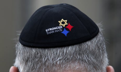 Man wearing a yarmulke saying 'stronger than hate'