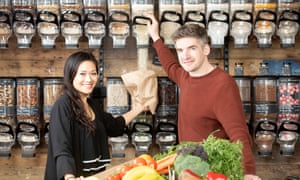 Jeanette Wong and Tom Pell the co-founders of the Clean Kilo, a zero waste supermarket in BirminghamPics - Adrian Sherratt - 07976 237651 Observer - ‘Food Monthly’. Jeanette Wong and Tom Pell the co-founders of the Clean Kilo, a zero waste supermarket in Birmingham (2 Apr 2019). - Pouring organic Millet Flakes.