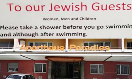 The sign asking Jewish guests to take a shower, and the entrance of the hotel in Arosa, Switzerland