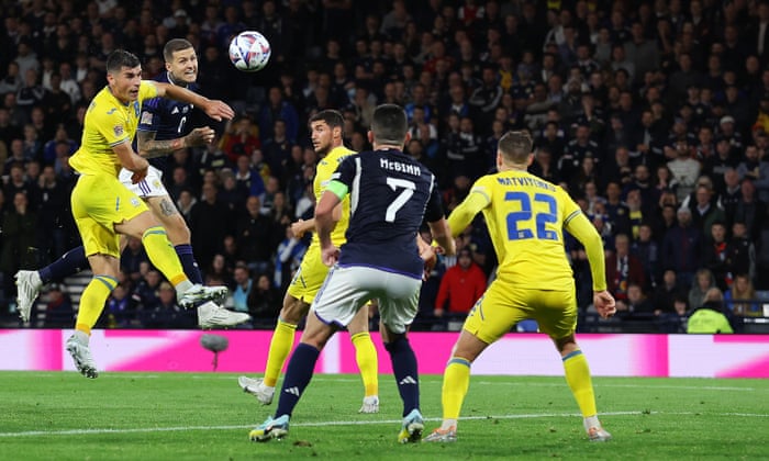 Lyndon Dykes heads home to double Scotland’s lead.