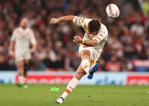 Catalans Dragons’ James Maloney thumps the ball between the posts.