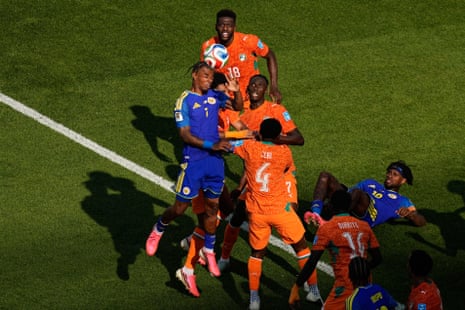 Curaçao's Juninho Bacuna (left) heads the ball.