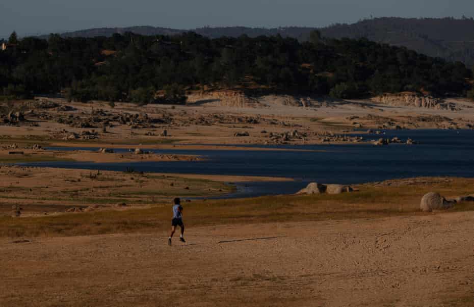 A park visitor runs on the dry Folsom Lake bottom in Granite Bay.