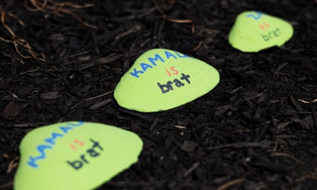 Three painted bright green shells that read 'Kamala is brat'