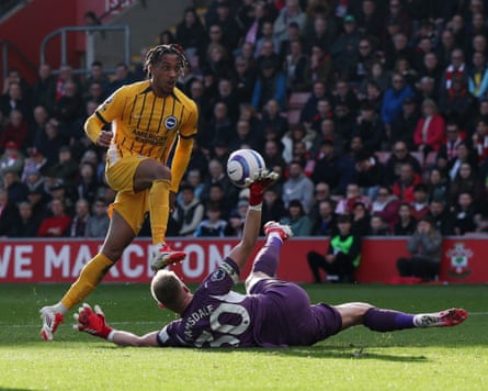 João Pedro lifts the ball over Southampton's Aaron Ramsdale to score for Brighton