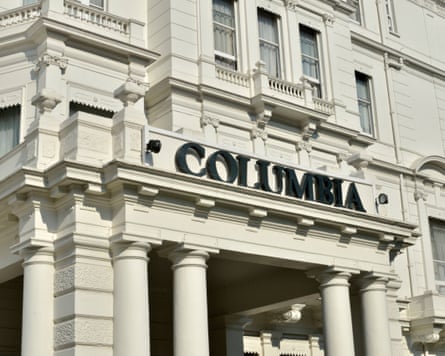 white hotel with sign saying columbia