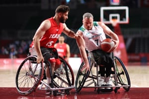 Tokyo Paralympics day two: GB golds in pool and track cycling – live! 2 Shaun Norris of Australia battles with Iman Bagzadhfard of Iran during their Wheelchair Basketball Men’s preliminary round group B match.