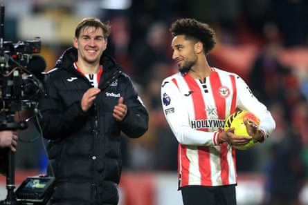 Kevin Schade carries the match ball after his hat-trick for Brentford