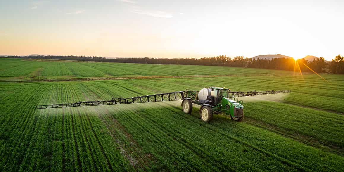 Spraying crops with pesticides