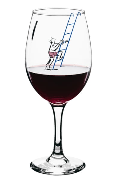 Man climbing out of a red wine glass