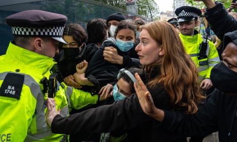 Protesters prevent the attempted forced removal of migrants from a hotel in south London