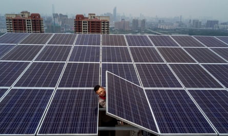 A man works on a solar panel project in Wuhan, China.