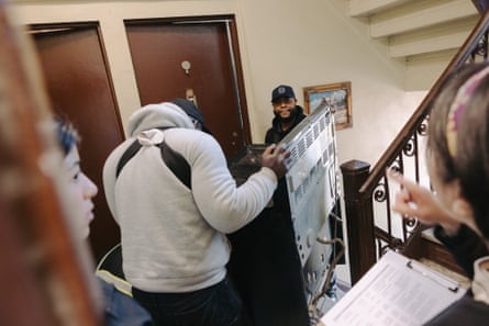 A gas stove is carried out of an apartment in a co-op building in Washington Heights March 24, 2026.
