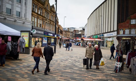 Shoppers walk through Barnsley town centre