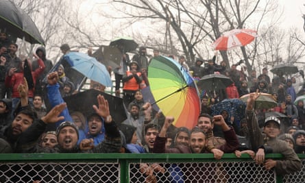 Fans of Real Kashmir cheer during their I-League club football match against Gokulam Kerala FC at the Tourist Reception Centre football ground in Srinagar.