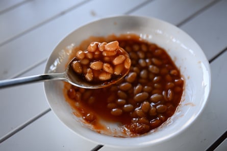 Baked beans in a white bowl.