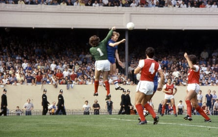 David Speedie of Chelsea goes up for a header against Arsenal keeper Pat Jennings