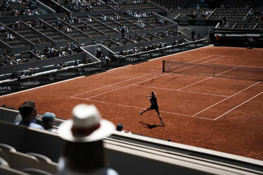 Spectators watch on a sparse Philippe Chatrier court.