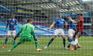 Brighton & Hove Albion’s Lewis Dunk scores an own goal and Manchester United are level.