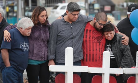 Friends and family of Ricardo and Therese Rodriguez mourn their loss while visiting a memorial to honor the Texas church shooting victims.