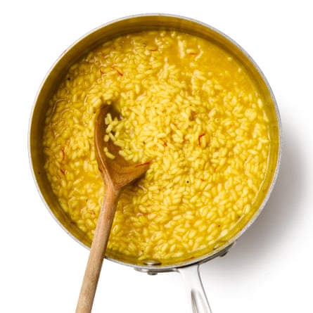 Ric ein a pan. Saffron, as used in the classic Milanese risotto, is a lovely choice here, because it helps gives the arancini a fittingly golden colour, but flavour the base with whatever herbs and spices you fancy, along with the salt.