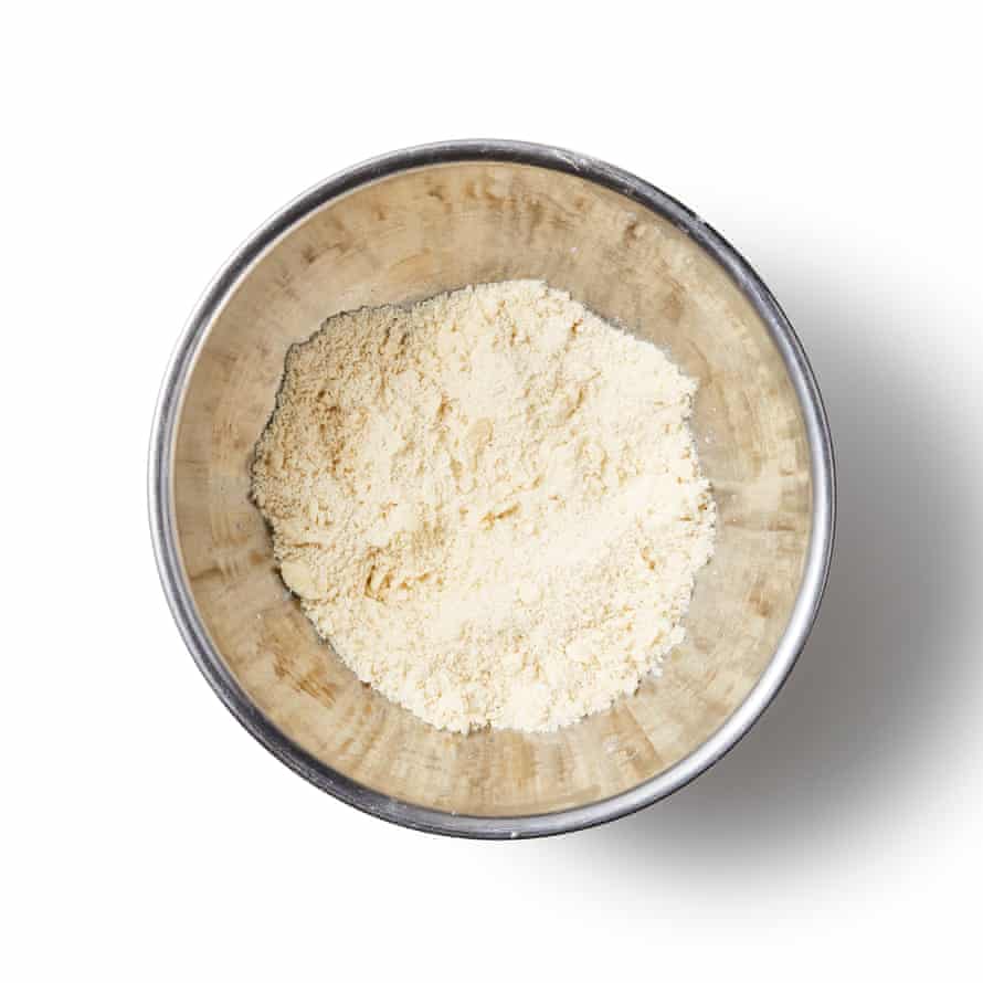 Felicity Cloake’s Bakewell tart 2c Mix the flour and salt in a bowl, then grate in the cold butter. Rub this in with your fingertips until the flour looks like damp sand, then very gradually stir in just enough cold water to bring everything together into a coherent, but not sticky dough