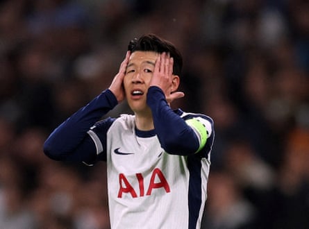 Son Heung-min holds his face