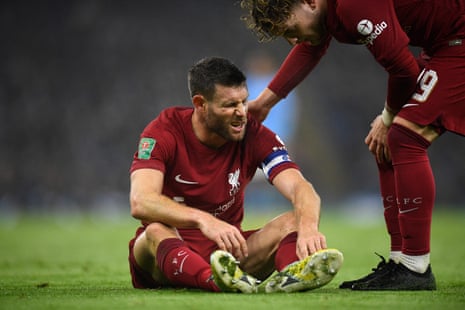 James Milner goes down injured.