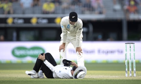Aleem Dar holds his knee after a colliding with Mitchell Satner.