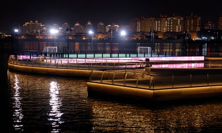 The floating football pitch on the sea behind the Katara Towers