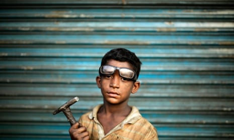 This nine-year-old boy works as an assistant to a carpenter in Dhaka, Bangladesh. A group of academics now claim that allowing young children to work can have positive effects.