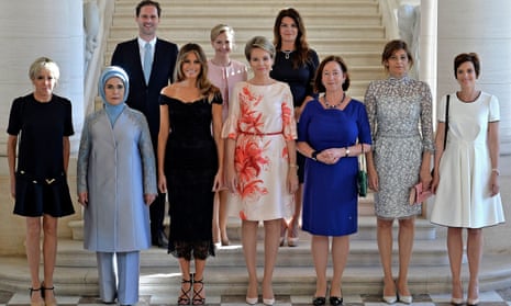 Gauthier Destenay, top left, poses with spouses of Nato leaders including Melania Trump.