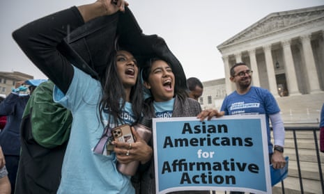 people cheer with sign that says 'asian americans for affirmative action'