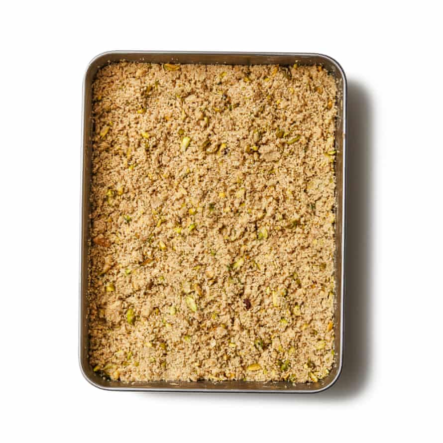 Felicity Cloake’s Baklava 06a Spoon the nut mixture evenly over the top layer of filo, making sure it’s fairly tightly packed without pressing it down too firmly. Top with the remaining filo, again brushing each sheet with butter before adding the next. Be extra generous with the butter on the top layer.