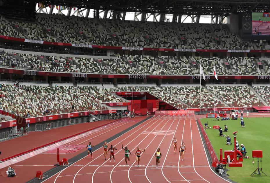The Olympic Stadium has been closed to fans - families have queued for a picture of the Olympic rings through the massive fence keeping them out