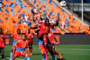 Ugandaâs forward Patrick Kaddu (right) heads the ball to score.
