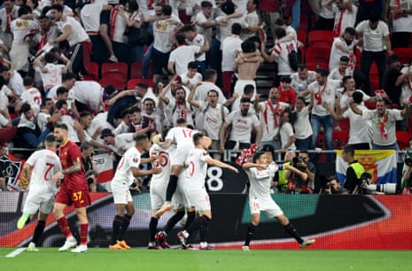Sevilla’s Jesus Navas with teammates celebrate after Roma’s Gianluca Mancini scored an own goal and Sevilla’s equaliser.