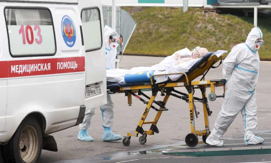 Paramedics admit a Covid patient at Novomoskovsky medical centre in Moscow