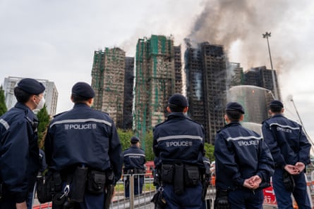 Police officers gather at the complex on Thursday morning.