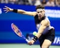 Ben Shelton returns against Carlos Alcaraz during their US Open quarter-final at Flushing Meadows.