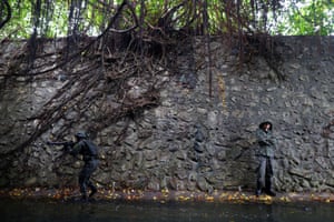 Trainees navigate sewage contaminated water