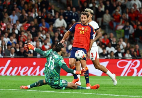 Spain's Mikel Oyarzabal scores their third goal.
