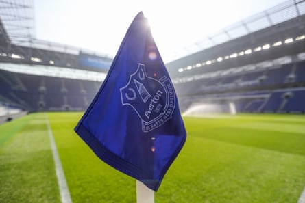 An Everton corner flag in the foreground with the pitch and stands at Liverpool's Hill Dickinson stadium behind it