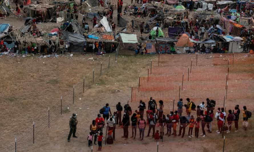 Migrants near the International Bridge in Del Rio, Texas, are prepared for transport.